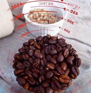 Roasted coffee from this morning. Green coffee beans just above that.