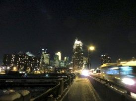 Downtown Minneapolis, looking southwest from the Central Avenue NE bridge. The reflection from the Mississippi River is visible in the lower-left corner of this photo.