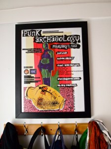 Joel's art, the February 2013 Punk Archaeology un-conference poster, hangs in our front entryway.